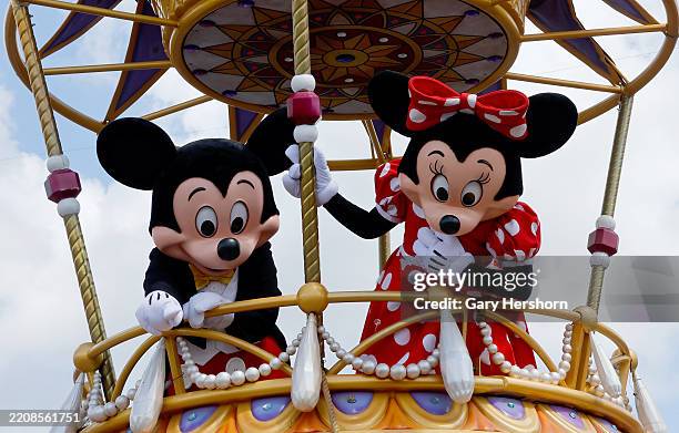 The Mickey Mouse and Minnie Mouse float passes by during the daily Festival of Fantasy Parade at the Magic Kingdom Park at Walt Disney World on April...