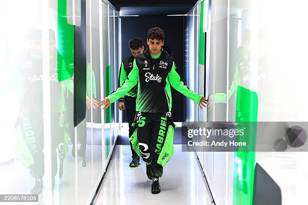 Gabriel Bortoleto of Brazil and Stake F1 Team Kick Sauber walks in the garage prior to final practice ahead of the F1 Grand Prix of Japan at Suzuka...