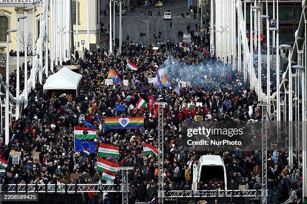 Protestors gather on Elisabeth Bridge, planning to block the bridge for 12 hours, due to legislation recently passed by the Hungarian national...