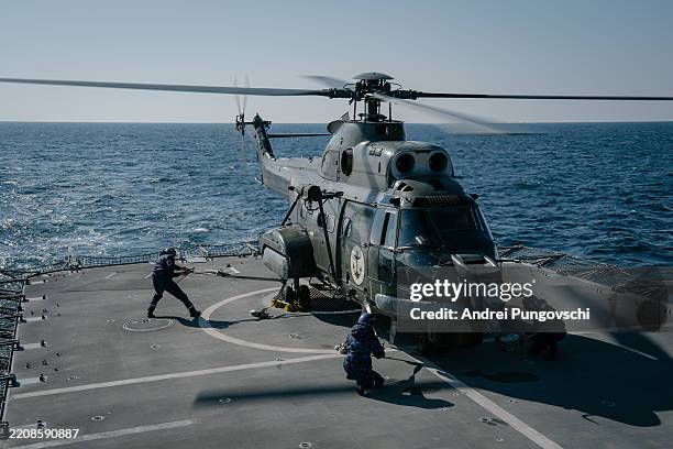 Romanian soldiers take part in the Sea Shield 25 multinational military exercise on board the frigate "Regina Maria" on April 8, 2025 in the Black...