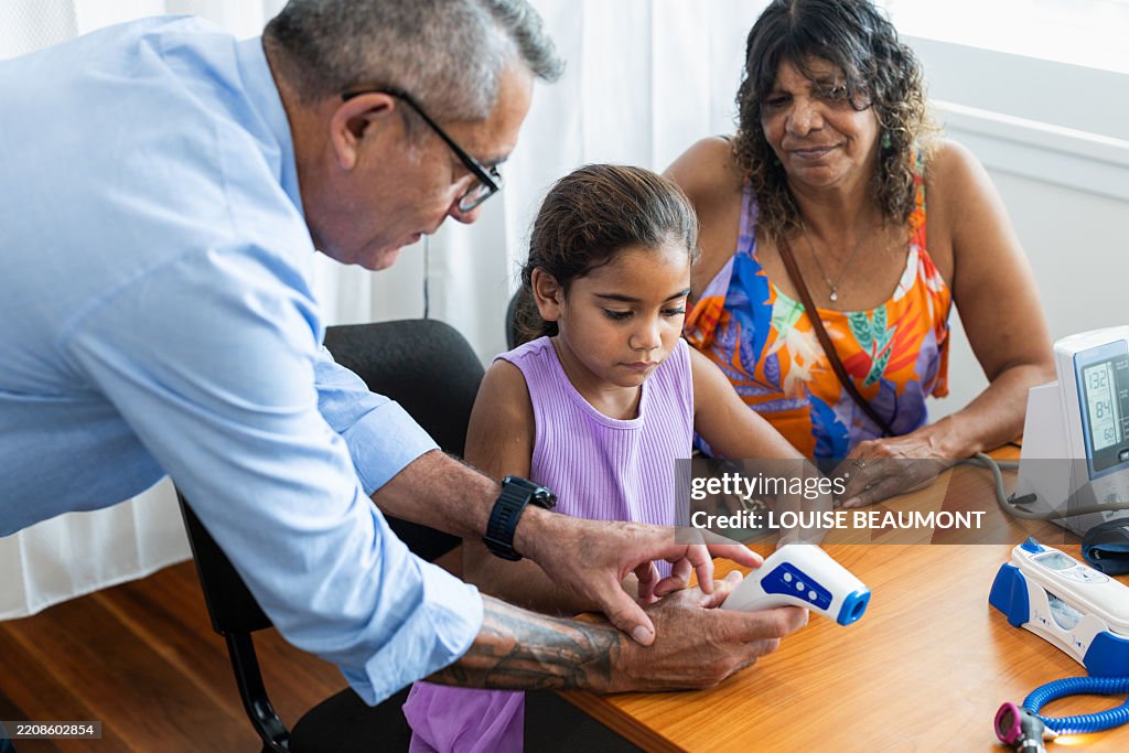 Young Aboriginal girl gets a check up at the doctor’s surgery