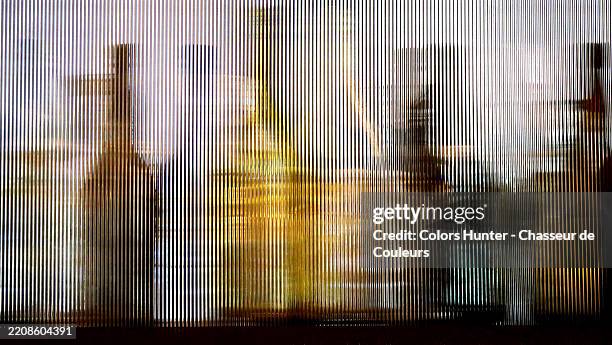 colorful and deformed bottles seen through a ribbed and textured window. manhattan (midtown), new york state, united states. colors. day light. - licores de alta graduación fotografías e imágenes de stock