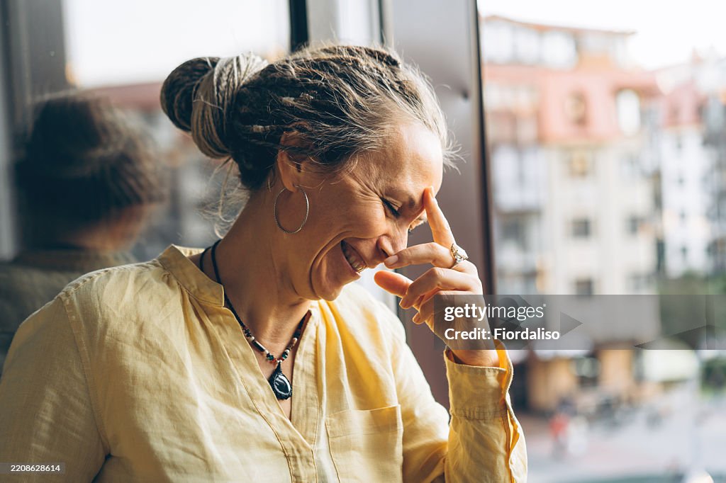 Portrait of a woman in yellow blouse