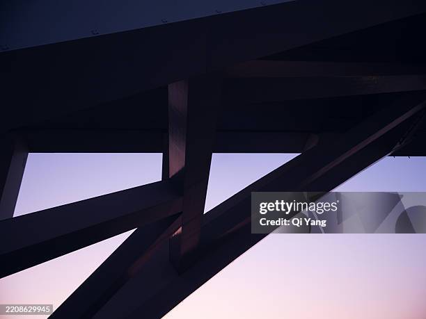 close-up of an arch bridge at dusk - bridge architecture up close night stock pictures, royalty-free photos & images