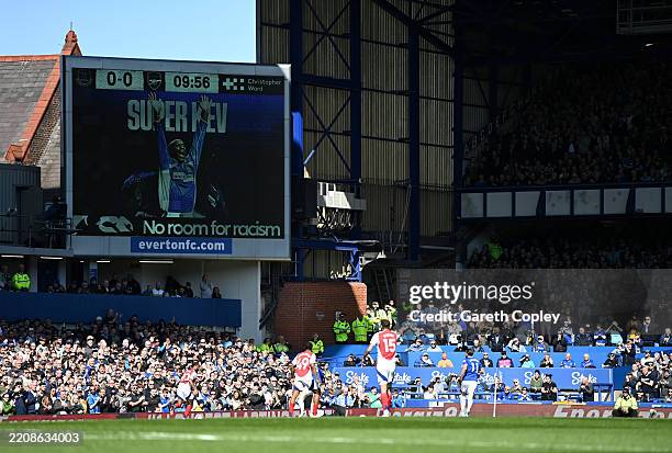 The LED board shows a tribute to Kevin Campbell during the Premier League match between Everton FC and Arsenal FC at Goodison Park on April 05, 2025...