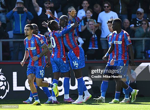 Jean-Philippe Mateta of Crystal Palace celebrates scoring his team's first goal with teammate Eberechi Eze during the Premier League match between...