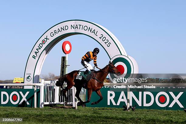 Nick Rockett ridden by Patrick Mullins celebrates as they cross the line to win the Randox Grand National Handicap Chase during Grand National Day at...