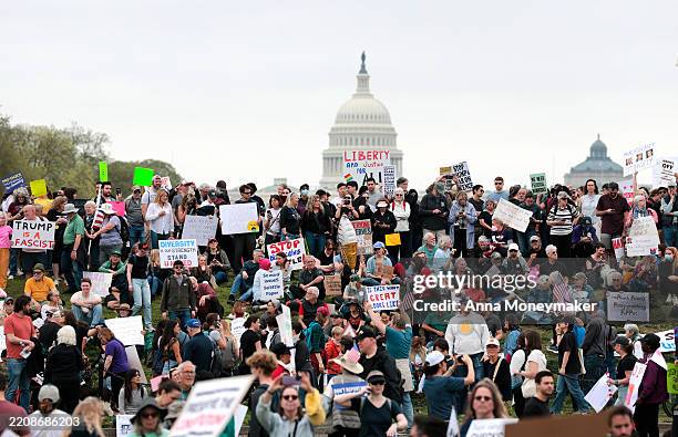Protesters attend a "Hands Off" rally to demonstrate against U.S. President Donald Trump on the National Mall on April 5, 2025 in Washington, DC....