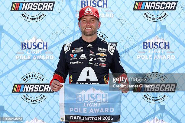 William Byron, driver of the Axalta Chevrolet, poses for photos after winning the pole award during qualifying for the NASCAR Cup Series Goodyear 400...