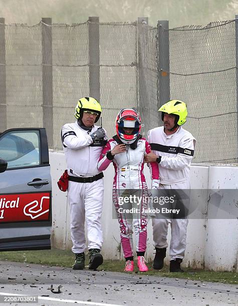 Marta Garcia of Spain and Iron Dames is assisted by marshals after a crash in her Porsche 911 GT3 R during the Le Mans Cup race at Circuit de...