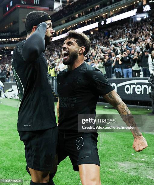 Memphis Depay of Corinthians celebrates with teammate Yuri Alberto after scoring the team's second goal during a Brasileirao Series A 2025 match...
