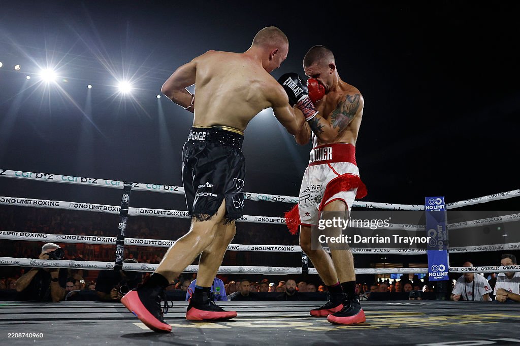 Koen Dan Hill of Australia punches Koen Mazoudier of Australia during the ...