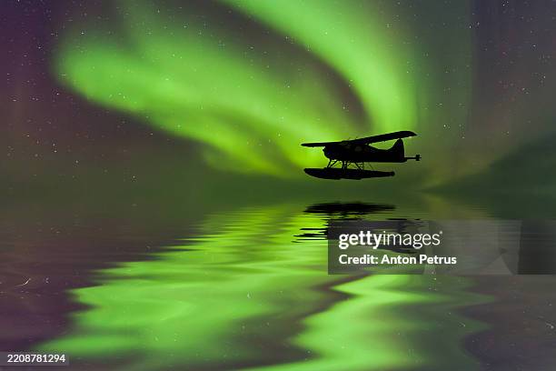seaplane under the northern lights - small plane flight stock pictures, royalty-free photos & images