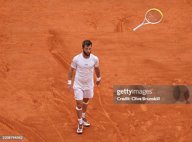 Corentin Moutet of France throws his racket against David Goffin of Belgium during the Qualifying Final round during day one of the Rolex Monte-Carlo...
