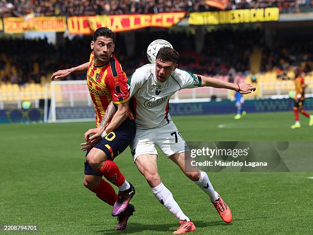 Sntiago Pierotti of Lecce competes for the ball with Andrea Carboni of Venezia during the Serie A match between Lecce and Venezia at Stadio Via del...