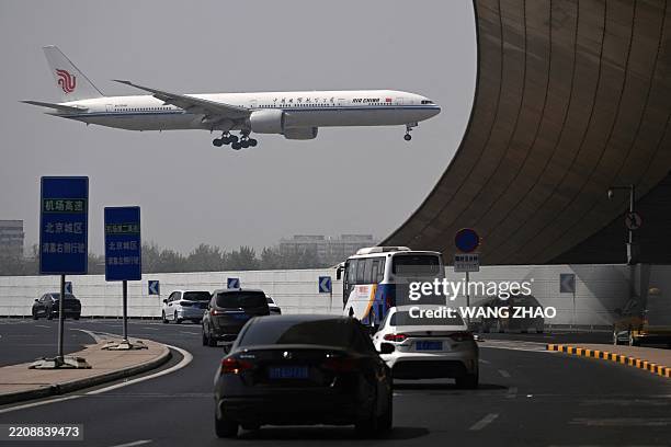 An Air China Boeing 777-300 plane lands at Beijing International airport on April 10, 2025.