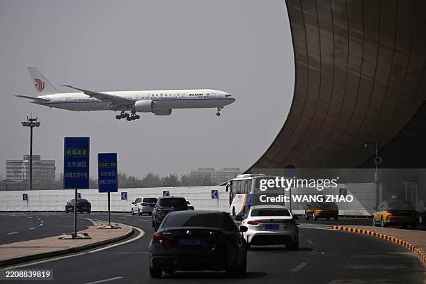 An Air China Boeing 777-300 plane lands at Beijing International airport on April 10, 2025.