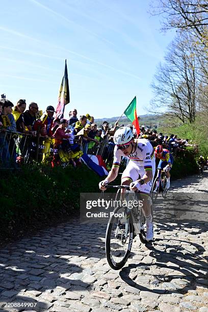 Tadej Pogacar of Slovenia and Team UAE Team Emirates - XRG competes in the chase group passing through the Koppenberg cobblestones sector during the...