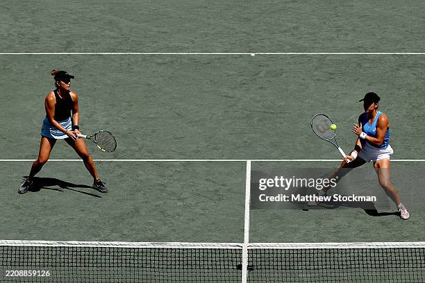 Desirae Krawczyk of United States and Caroline Dolehide of United States play Jelena Ostapenko of Latvia play Erin Routliffe of New Zealand during...