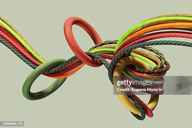 colorful ropes intertwining, creating a visually appealing abstract composition - tied knot stock pictures, royalty-free photos & images