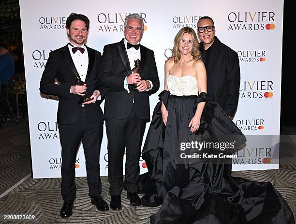 Mark Aspinall and Darren Clark, winners of the Outstanding Musical Contribution award, pose with presenters Harriet Scott and Gok Wan in the Winners...