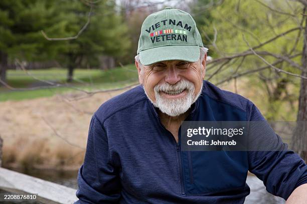 vietnam veteran looking at camera outdoors - war veteran stock pictures, royalty-free photos & images