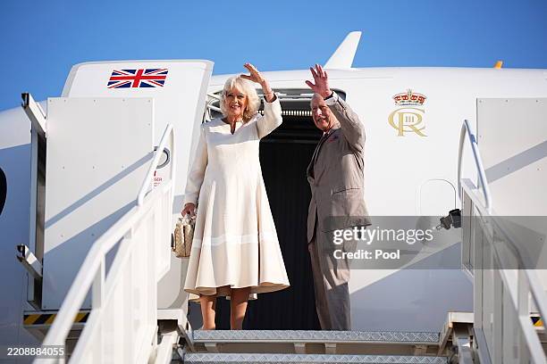 Britain's King Charles III and Queen Camilla wave as they depart from Forli Airport at the end of their State visit to The Republic of Italy on April...