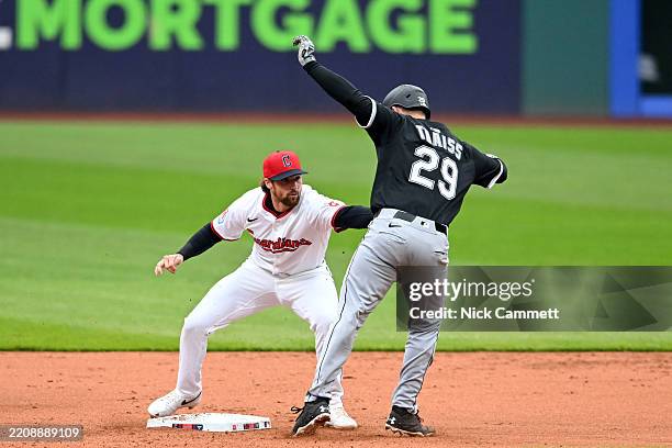 Matt Thaiss of the Chicago White Sox is caught stealing second base by Daniel Schneemann of the Cleveland Guardians during the first inning at...
