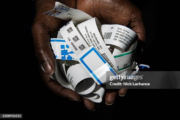 Toronto, ON Andrea Scott holds six months worth of hospital bracelets from her continuing cancer treatment. PD Nick Lachance/Toronto Star Nick...