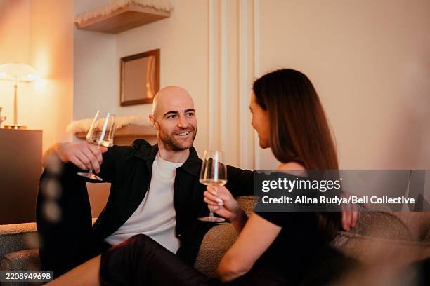 cute couple having a date night at home - wine date stock pictures, royalty-free photos & images