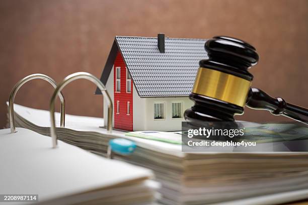 House, money and judgment – ​​concept image of real estate law and financing