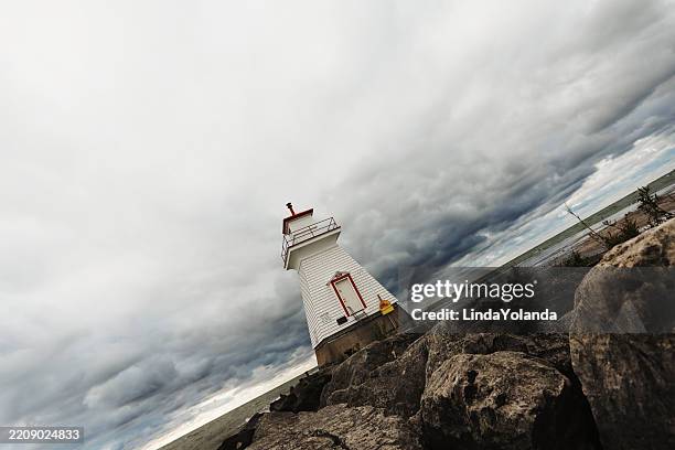 lighthouse in rough water - lake huron waves stock pictures, royalty-free photos & images