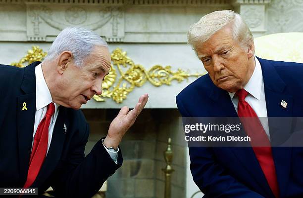 Israeli Prime Minister Benjamin talks to U.S. President Donald Trump during a meeting in the Oval Office of the White House on April 7, 2025 in...