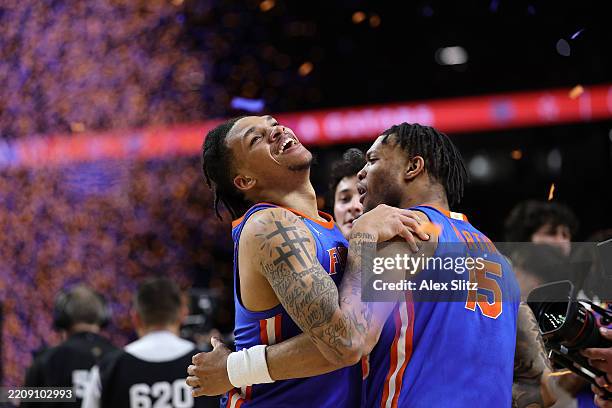 Will Richard of the Florida Gators celebrates with Alijah Martin during the second half in the National Championship of the NCAA Men's Basketball...