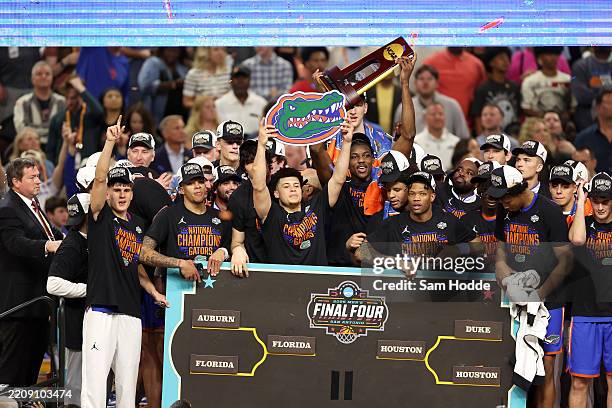 The Florida Gators celebrate after defeating the Houston Cougars in the National Championship of the NCAA Men's Basketball Tournament at the...