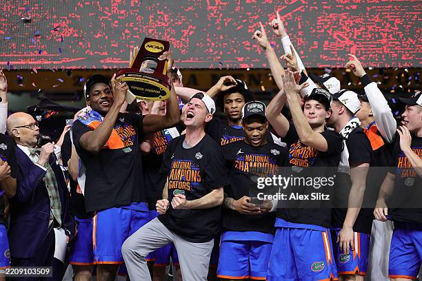 The Florida Gators celebrate after defeating the Houston Cougars in the National Championship of the NCAA Men's Basketball Tournament at the...