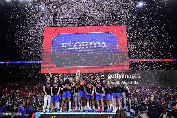 The Florida Gators celebrate after defeating the Houston Cougars in the National Championship of the NCAA Men's Basketball Tournament at the...