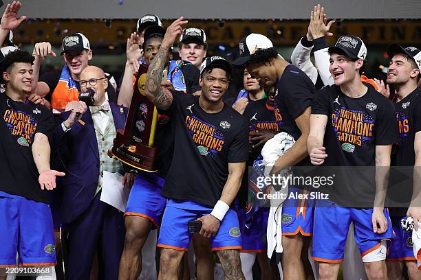 The Florida Gators celebrate after defeating the Houston Cougars in the National Championship of the NCAA Men's Basketball Tournament at the...