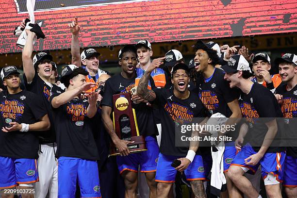 The Florida Gators celebrate after defeating the Houston Cougars in the National Championship of the NCAA Men's Basketball Tournament at the...