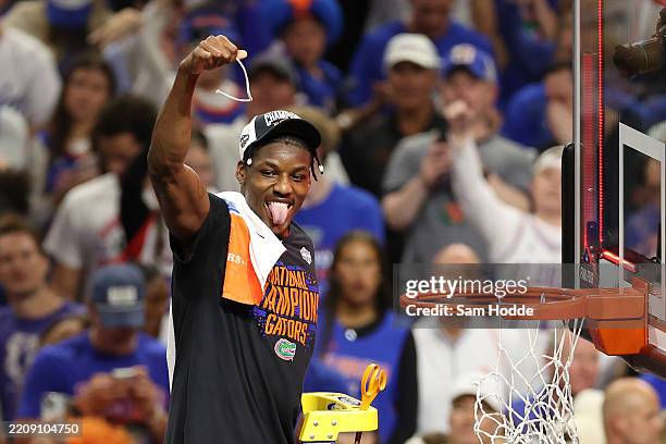 Rueben Chinyelu of the Florida Gators cuts the net after defeating the Houston Cougars in the National Championship of the NCAA Men's Basketball...