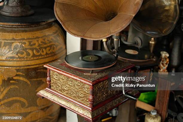 old gramophone with a vynil disc - gramophone stock pictures, royalty-free photos & images