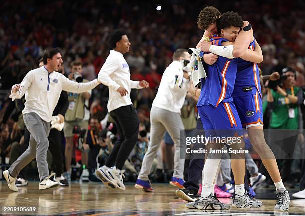Walter Clayton Jr. #1 and Micah Handlogten of the Florida Gators celebrate after defeating the Houston Cougars in the National Championship of the...