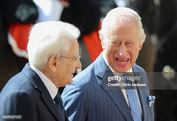 King Charles III laughs with Italian President Sergio Mattarella as they attend the ceremonial welcome ceremony at the Quirinale Palace during day...