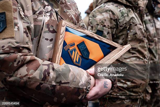 People attend the funeral ceremony of the artist Margaryta Polovynko, who was also a service member of the 3rd Assault Brigade, who is killed during...