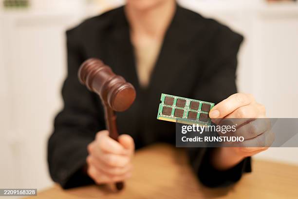 image of a gavel and computer parts - female power suit stock pictures, royalty-free photos & images