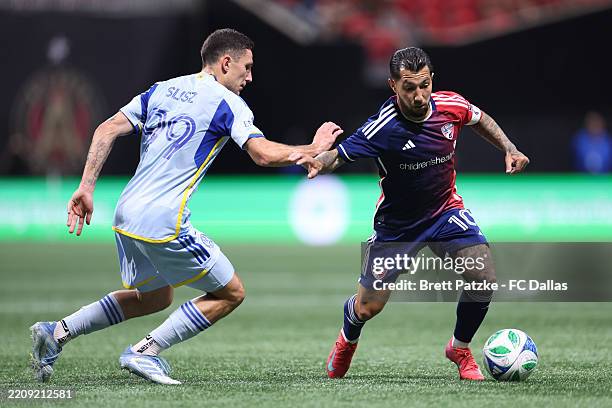 Luciano Acosta of FC Dallas controls the ball whilst under pressure from Bartosz Slisz of Atlanta United during the MLS match between Atlanta United...