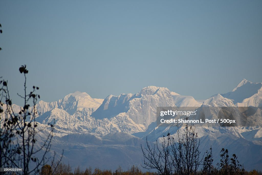 The Mooses Tooth rises in the Alaska Range,Showcasing rugged,Snow-covered cliffs under a blue sky,Talkeetna,Alaska,United States,USA