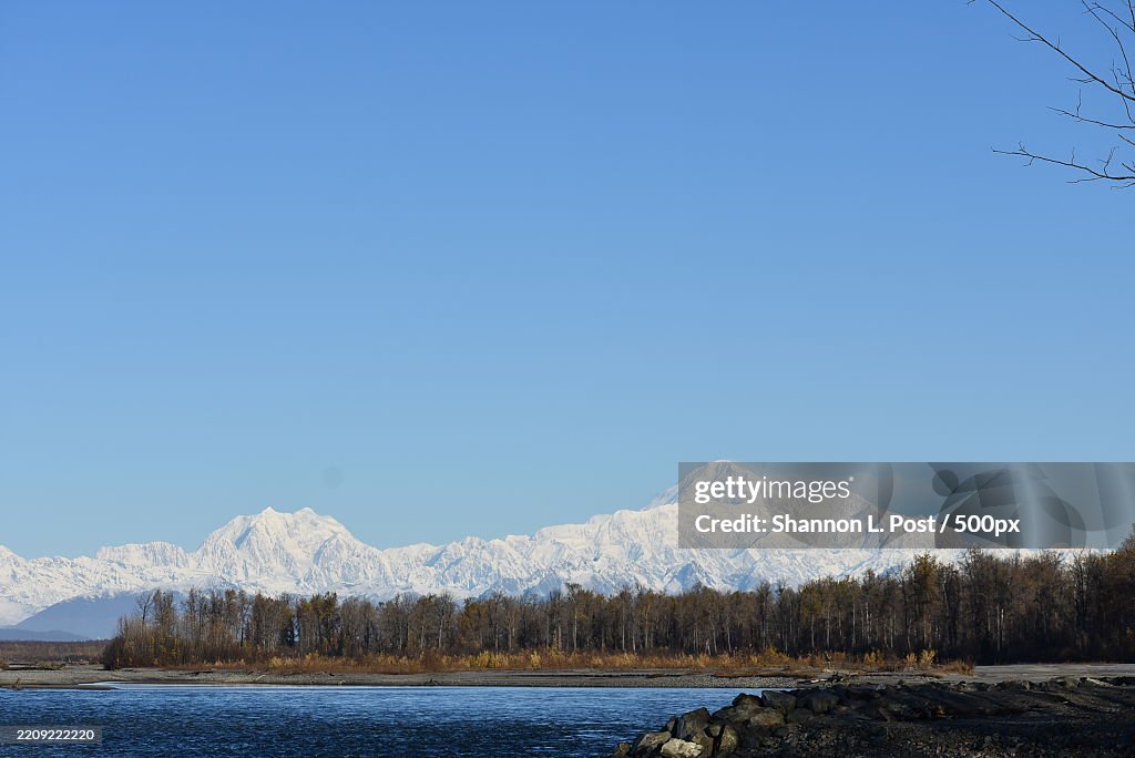 Denali Mt Mc Kinley and Begguya Mount Hunter covered in snow,Towering over the Talkeetna River,Talkeetna,Alaska,United States,USA