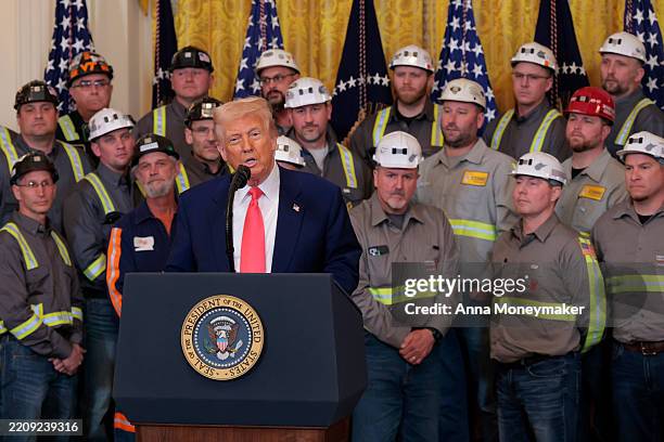 President Donald Trump speaks alongside coal and energy workers during an executive order signing ceremony in the East Room of the White House on...