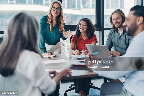 young businesswoman talking to the company manager during a meeting - risk management stock pictures, royalty-free photos & images
